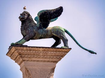 Statue of the Lion of St. Mark on the column on the Doge's Palace side of the Piazzetta San Marco in Venice