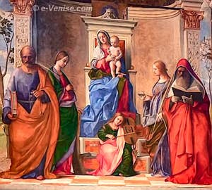 Giovanni Bellini. Au centre la Vierge et l'Ange musicien