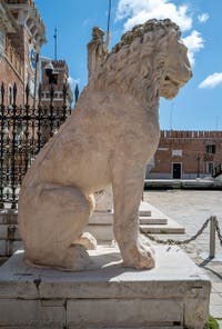 Lion from the port of Piraeus in Athens with its runic inscriptions, in front of the entrance to the Venice Arsenal