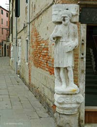 The statues of the three Mastelli brothers, Rioaba, Sandi and Afani, lined up on the Campo dei Mori in Venice's Cannaregio